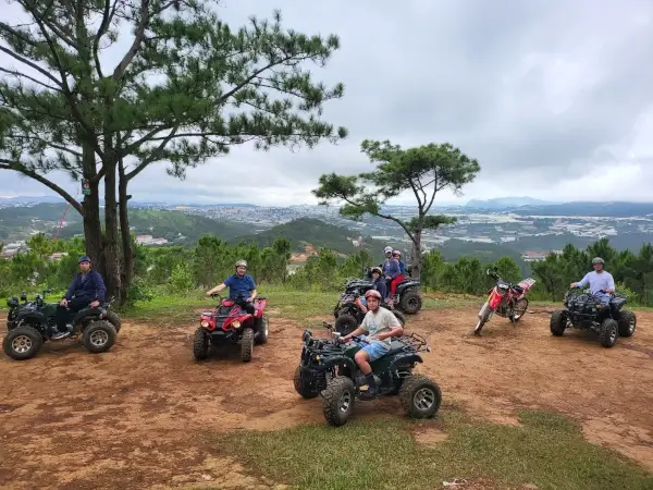 a tour having a photo at the top of a mountain.