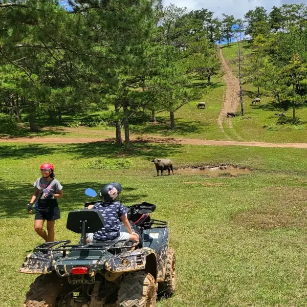 two girls posing infront of buffalo.