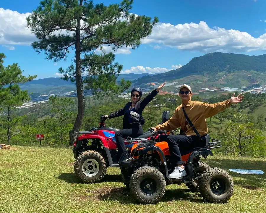 a couple on atvs for a photo.